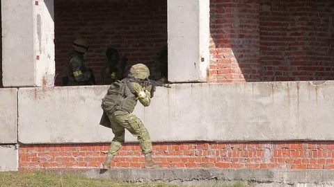Armed soldier with automatic rifle aiming Stock Footage 81671850