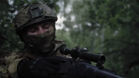 Armed soldier with sniper rifle, in dense forest, completed special operation Stock Footage 327288714