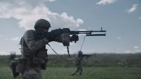 Armed soldiers with machine guns in their hands shoot at opponents Stock Footage 327447668
