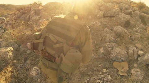 Armed soldiers walking through field. soldiers running with Machine gun weapons. Stock Footage 40072900