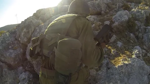 Armed soldiers walking through field. soldiers running with Machine gun weapons. Stock Footage 40074524