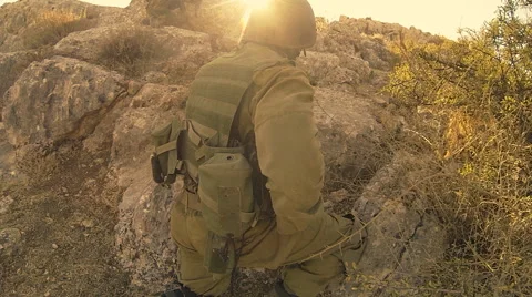 Armed soldiers walking through field. soldiers running with Machine gun weapons. Stock Footage 40083052