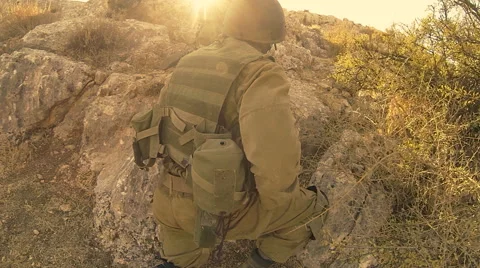Armed soldiers walking through field. soldiers running with Machine gun weapons. Stock Footage 40083497