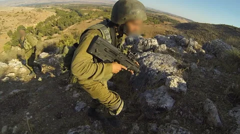 Armed soldiers walking through field. soldiers running with Machine gun weapons. Stock Footage 40085255