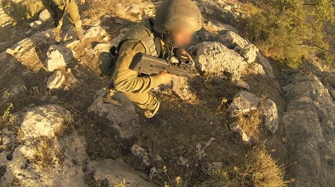 Armed soldiers walking through field. soldiers running with Machine gun weapons. Stock Footage 40086006