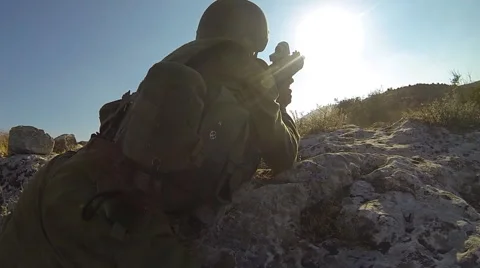 Armed soldiers walking through field. soldiers running with Machine gun weapons. Stock Footage 40110030