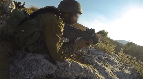 Armed soldiers walking through field. soldiers running with Machine gun weapons. Stock Footage 40112308