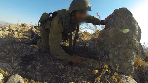 Armed soldiers walking through field. soldiers running with Machine gun weapons. Stock Footage 40165358