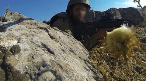 Armed soldiers walking through field. soldiers running with Machine gun weapons. Stock Footage 40209276