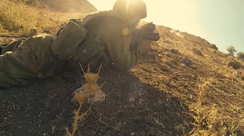 Armed soldiers walking through field. soldiers running with Machine gun weapons. Stock Footage 40254926