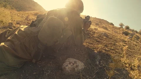 Armed soldiers walking through field. soldiers running with Machine gun weapons. Stock Footage 40260050