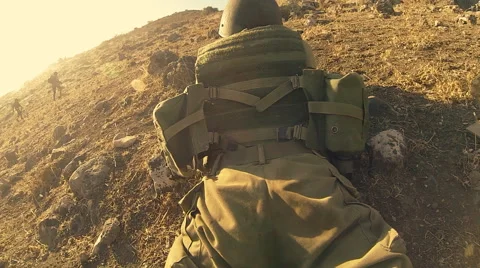 Armed soldiers walking through field. soldiers running with Machine gun weapons. Stock Footage 40262584