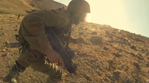 Armed soldiers walking through field. soldiers running with Machine gun weapons. Stock Footage 40266065