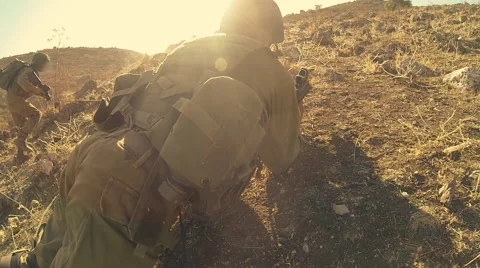 Armed soldiers walking through field. soldiers running with Machine gun weapons. Stock Footage 40270853