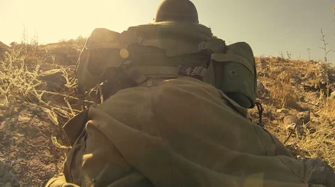 Armed soldiers walking through field. soldiers running with Machine gun weapons. Stock Footage 40276053