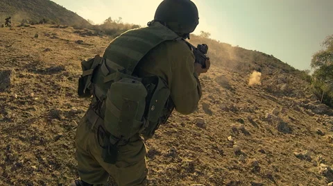 Armed soldiers walking through field. soldiers running with Machine gun weapons. Stock Footage 40289313