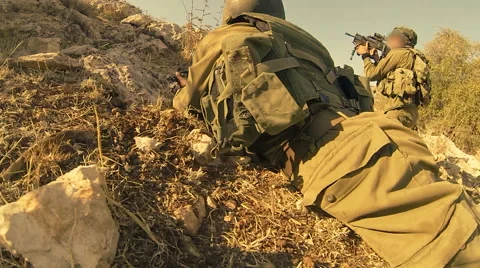Armed soldiers walking through field. soldiers running with Machine gun weapons. Stock Footage 40298010