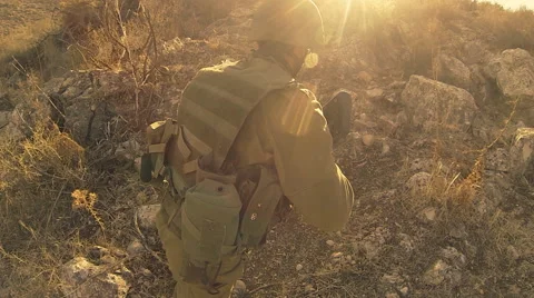 Armed soldiers walking through field. soldiers running with Machine gun weapons. Stock Footage 40309480