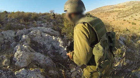 Armed soldiers walking through field. soldiers running with Machine gun weapons. Stock Footage 40316301