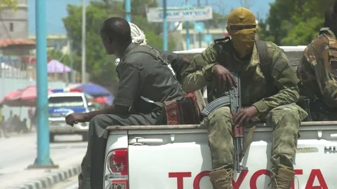 Armed Somalis recorded through car windshield Stock Footage 97720909