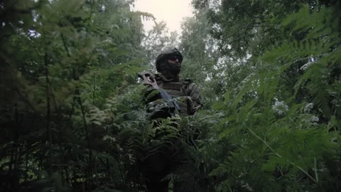 An armed special forces soldier with a machine gun in his hands Stock Footage 327355227