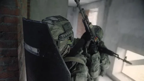 Armed special forces soldiers with rifles in their hands storm Stock Footage 327358457
