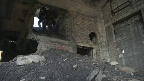 Armed Squad Going Down into Derelict Building Vídeos de archivo 82290330