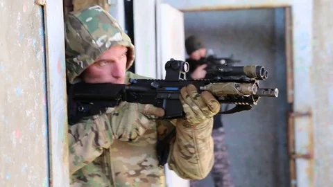 Armed SWAT Trainee Guards Open Doorway Stock Footage 70561589
