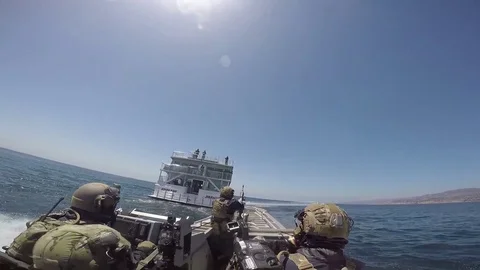Armed U.S. Coast Guard Security Response Team approach cruise ship  Stock Footage 90648731