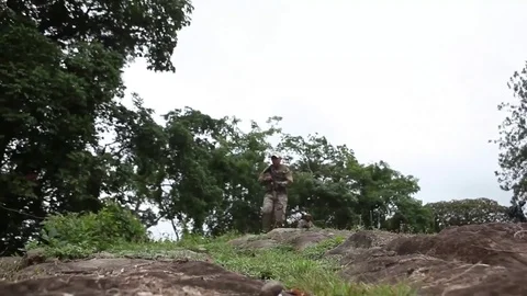 Armed U.S. soldier running down mud  Video stock 82384750
