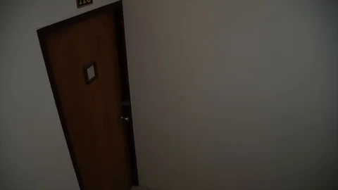 An armed young man in the mask breaks the door and smashes Video stock 102721773