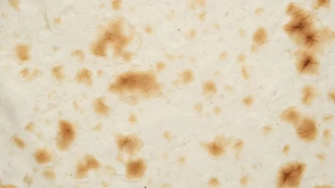 Armenian bread lavash rotating top view Stockbeeldmateriaal 131703084