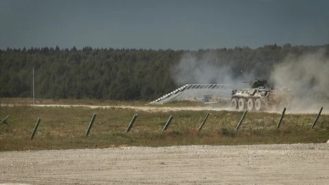Armored carrier shooting in slow motion Stock Footage