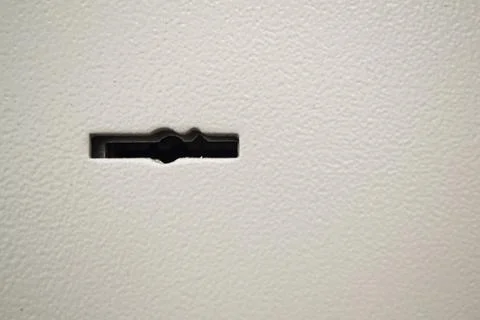 Armored front door, security lock for key. Safe keyhole close up Stock Photos