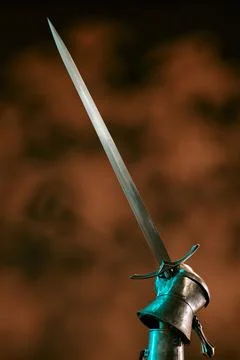 Armored Hand of Knight Holding Sharp Medieval Sword Upward Stock Photos