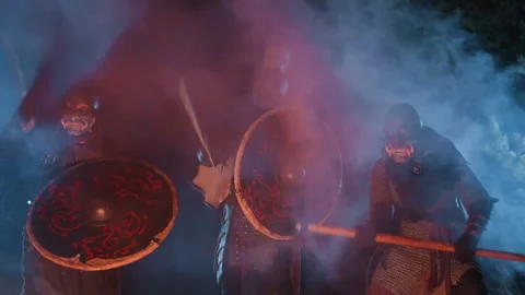 Armored warriors advancing in formation with shields raised and weapons poised Stock Footage 343686956