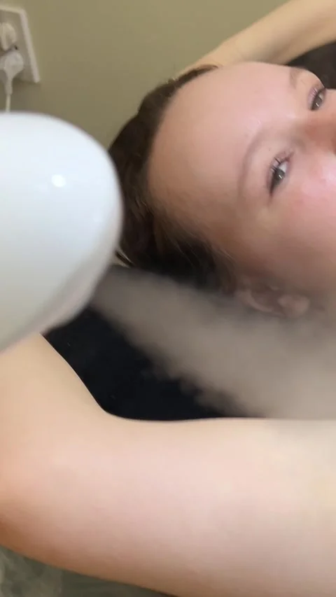 Armpits cooling device laser device handpiece next to a womans armpit, on which Stock Footage 313349831