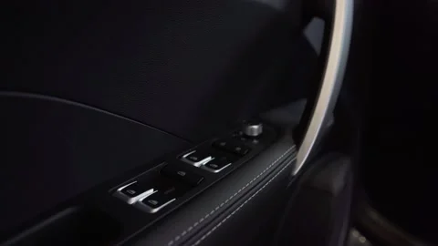 On the armrest the buttons for the electric elevating mechanism of windows in Stock Footage 157001861