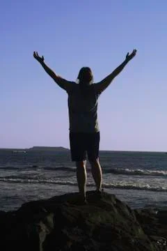 Arms up on the beach Stock Photos