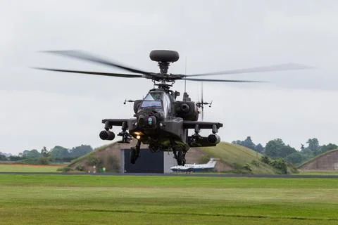 Army Air Corp Apache turns during a hover Stock Photos