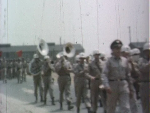 Army Band Marching Down Road - Vintage 8mm Stock Footage 78919514