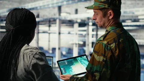 Army commander and software developer in data center use AI radar system Stock Footage 314686486