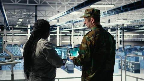 Army commander and software developer in data center use AI radar system Stock Footage 314805366
