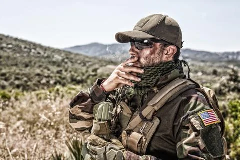 Army commando fighter in watch in mountain area Stock Photos