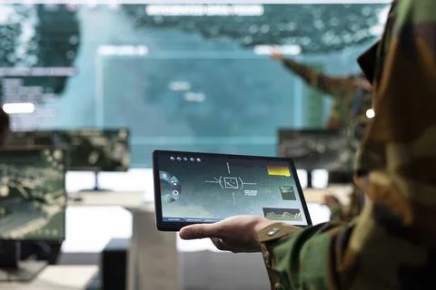 Army conscript detects targets on satellite world map to ensure national safety Stock Photos