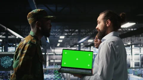Army engineering team in command center server hub using mockup laptop Stock Footage 310276921