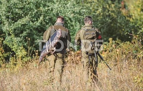 Army forces. Camouflage. Military uniform fashion. Friendship of men hunters Stock Photos