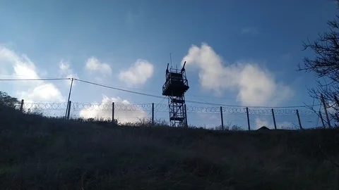 Army Guard Tower with Rolling Clouds Stock Footage 123000775