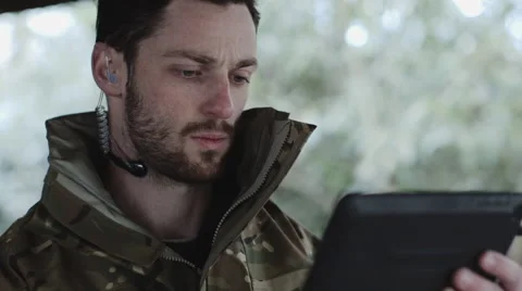 Army Instructor with Digital tablet and headphone giving instructions Stock-Footage 63342735