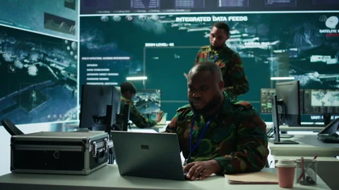 Army intelligence expert utilizes modern computer systems and satellite imagery Stock Footage 279951235